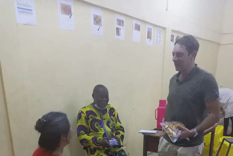 A Sense coach talks with a business owner and staff in their premises