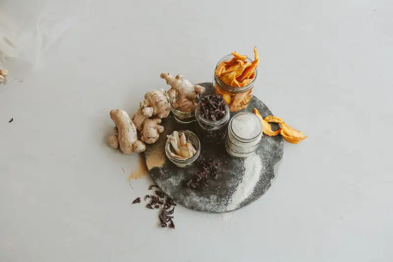 Dried mango, ginger and spices laid out as sample products